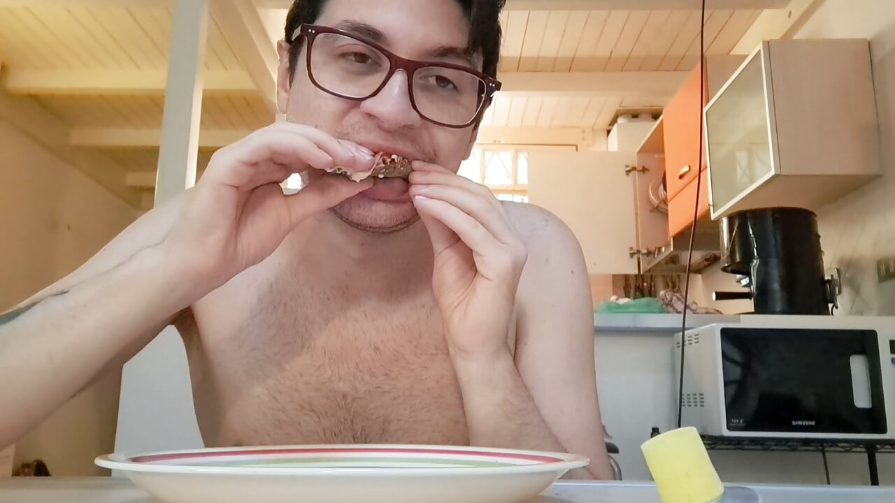 Pig guy eats a sandwich while jerking big cock