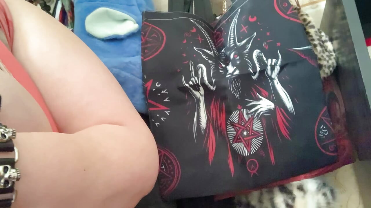 Metal babe show her tits at home