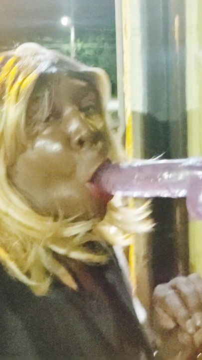 Sucking dildo in public