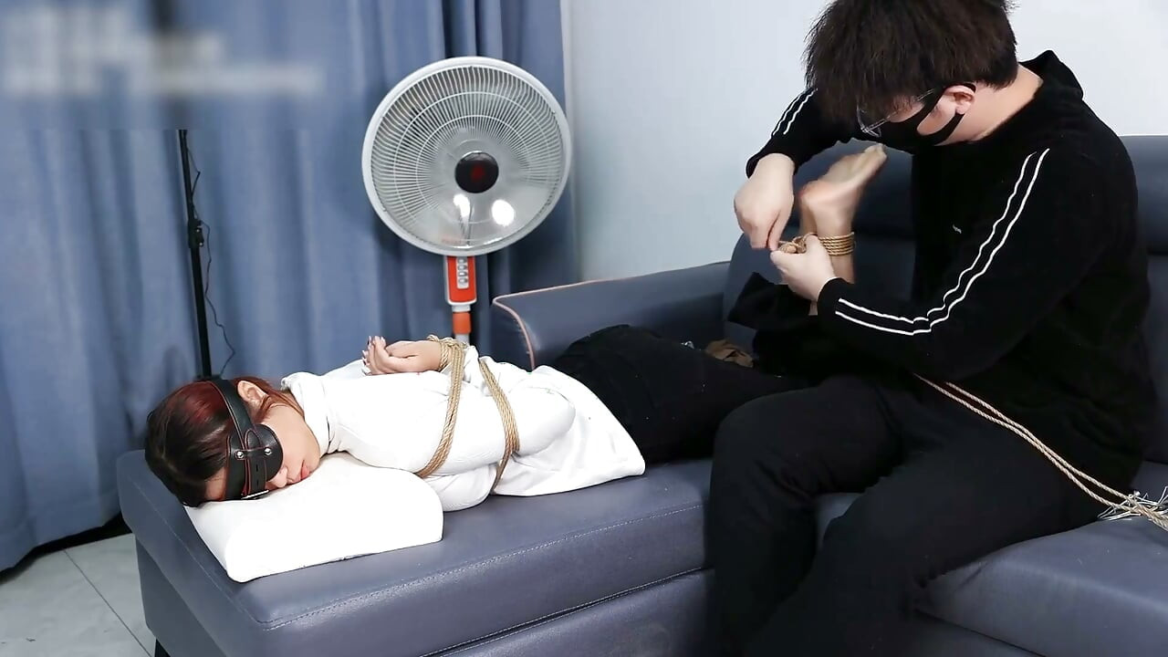 The Extreme Restraints of a Barefoot Girl, Playing with Her Bare Feet