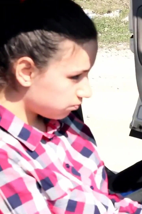 She is almost caught peeing in front of a car