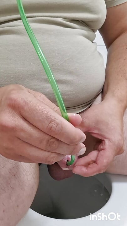 Cock stretching with 14mm ball sound and piss drained through silicone hose in peehole