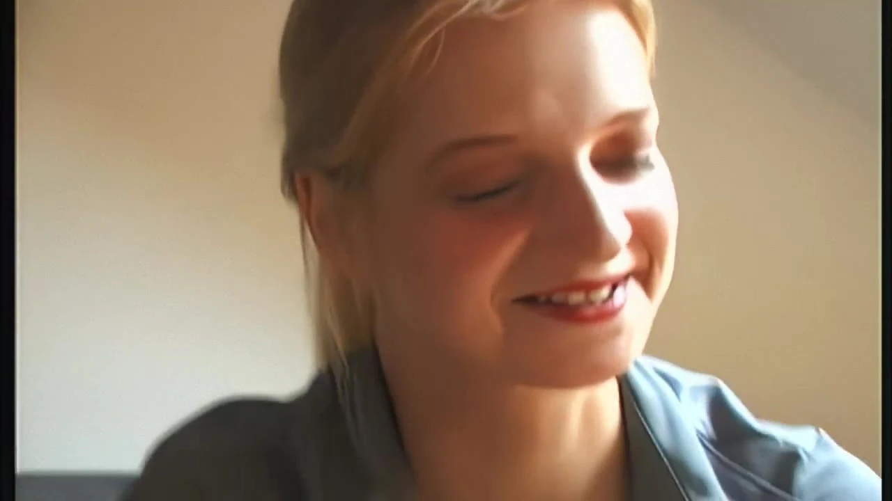 Blonde with big tits rubs herself on her moist cleft