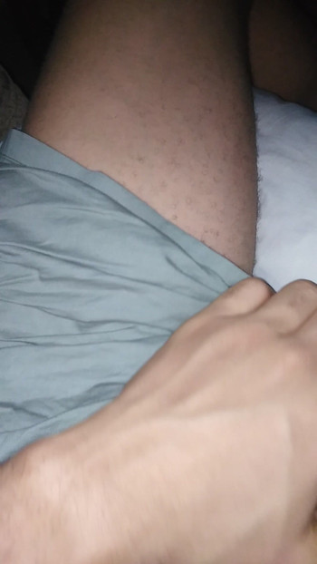Masturbating