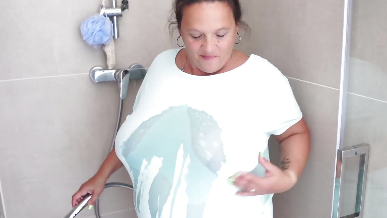Mature Brunette with Massive Tits Gets Steamy in the Shower