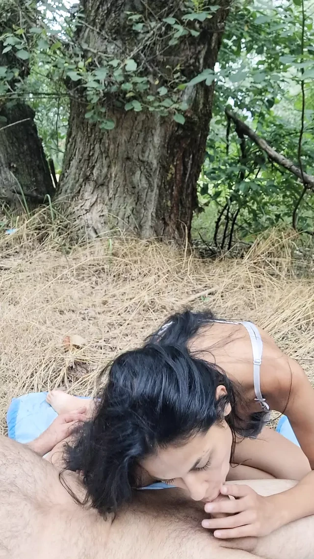 In the woods, on her knees, sucking the cock for her