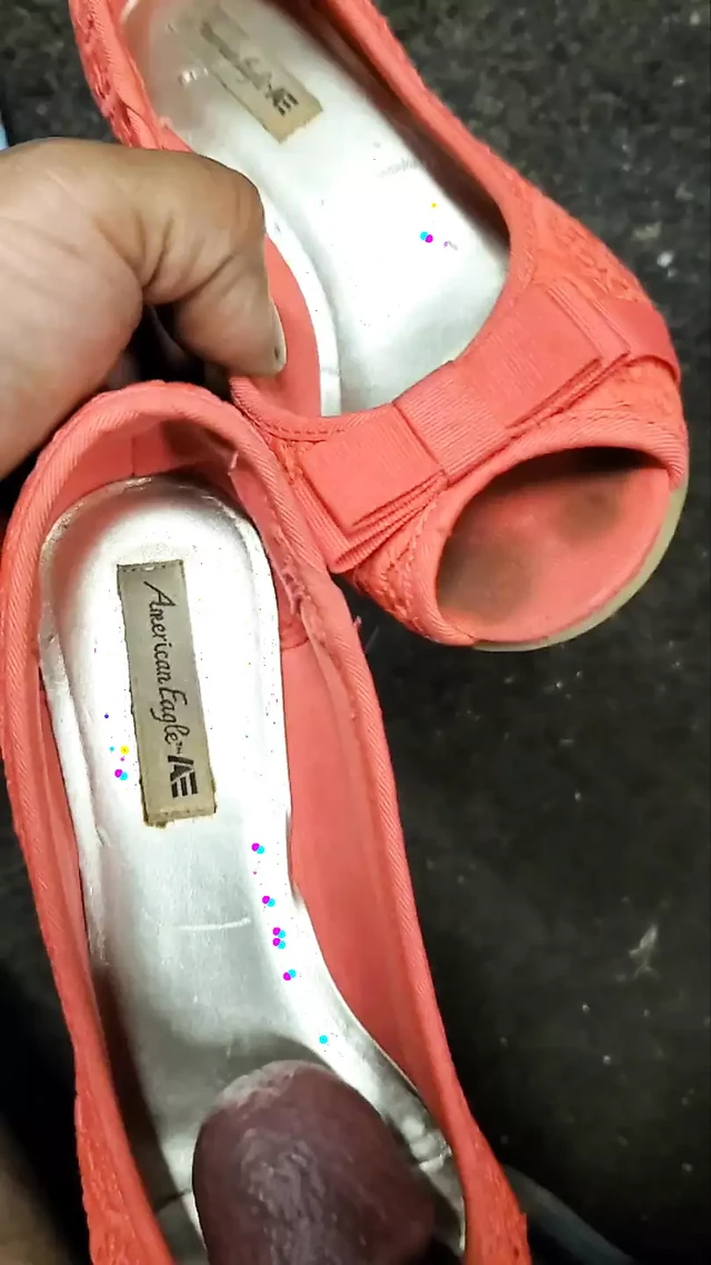 mechanic playing with pink open toe American Eagle heels