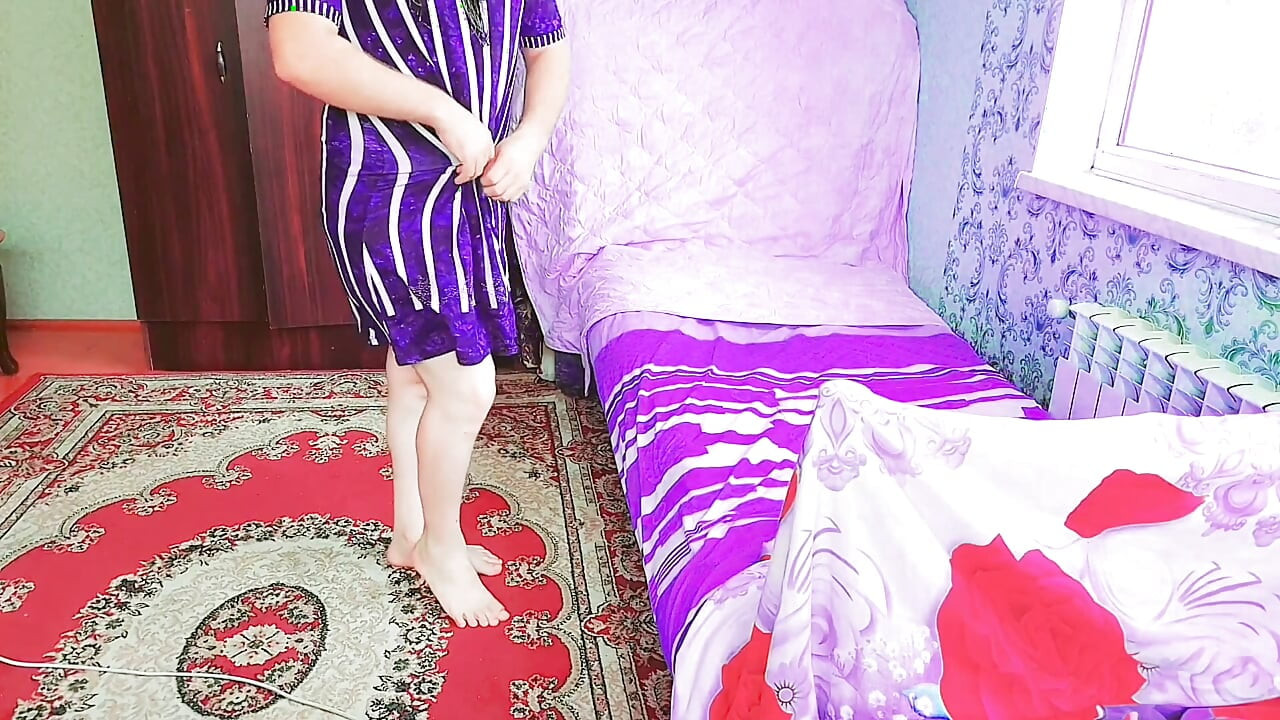 Stunning femboy adjusting skirt in front of mirror