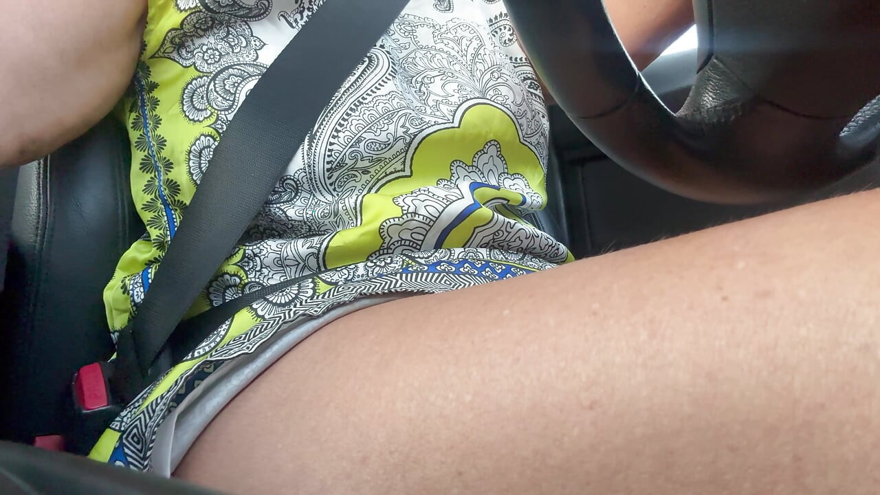 The beautiful and elegant stepmom Michelle drives to work in the morning.
