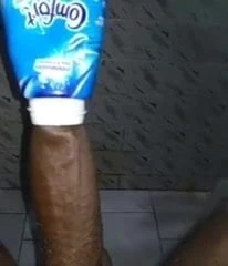 Desi boy inserting BBC into bottle