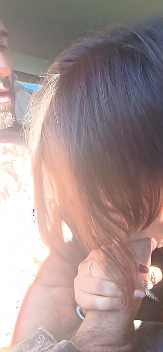 Mature sucking cock in the car
