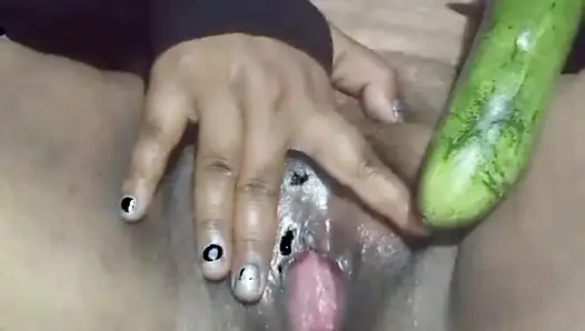 Today, Indian bhabhi quenched her desire by inserting a cucumber into her pussy.