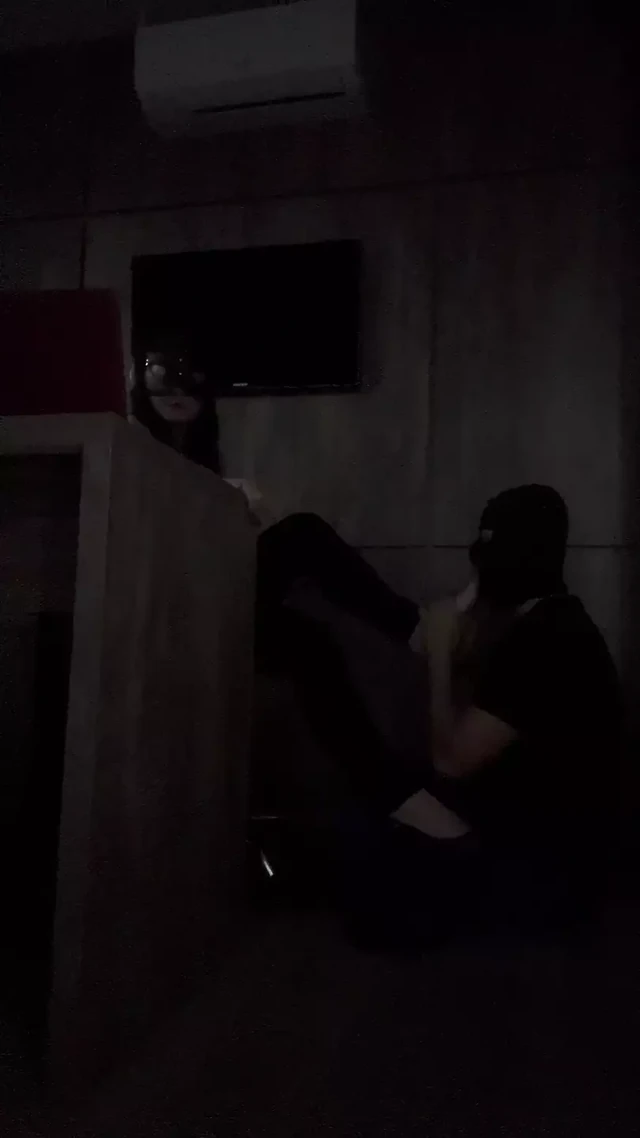 Slave massages desk feet