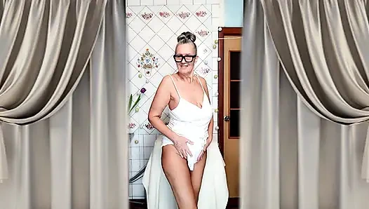 Hot mature housewife Lukerya undresses and teases with her huge tits in the kitchen