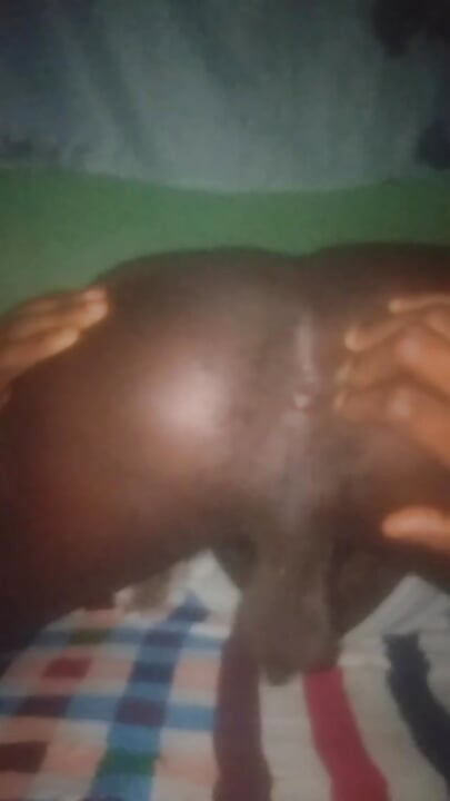 Flashing his big black ass.