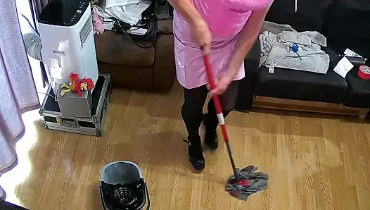 Mainboots cleaning the lounge in pink pvc outfit and high heel