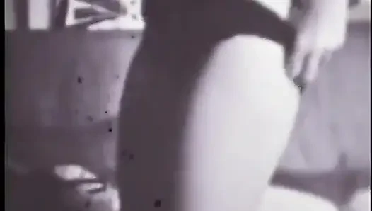 Strip-tease of a blonde woman in the sixties