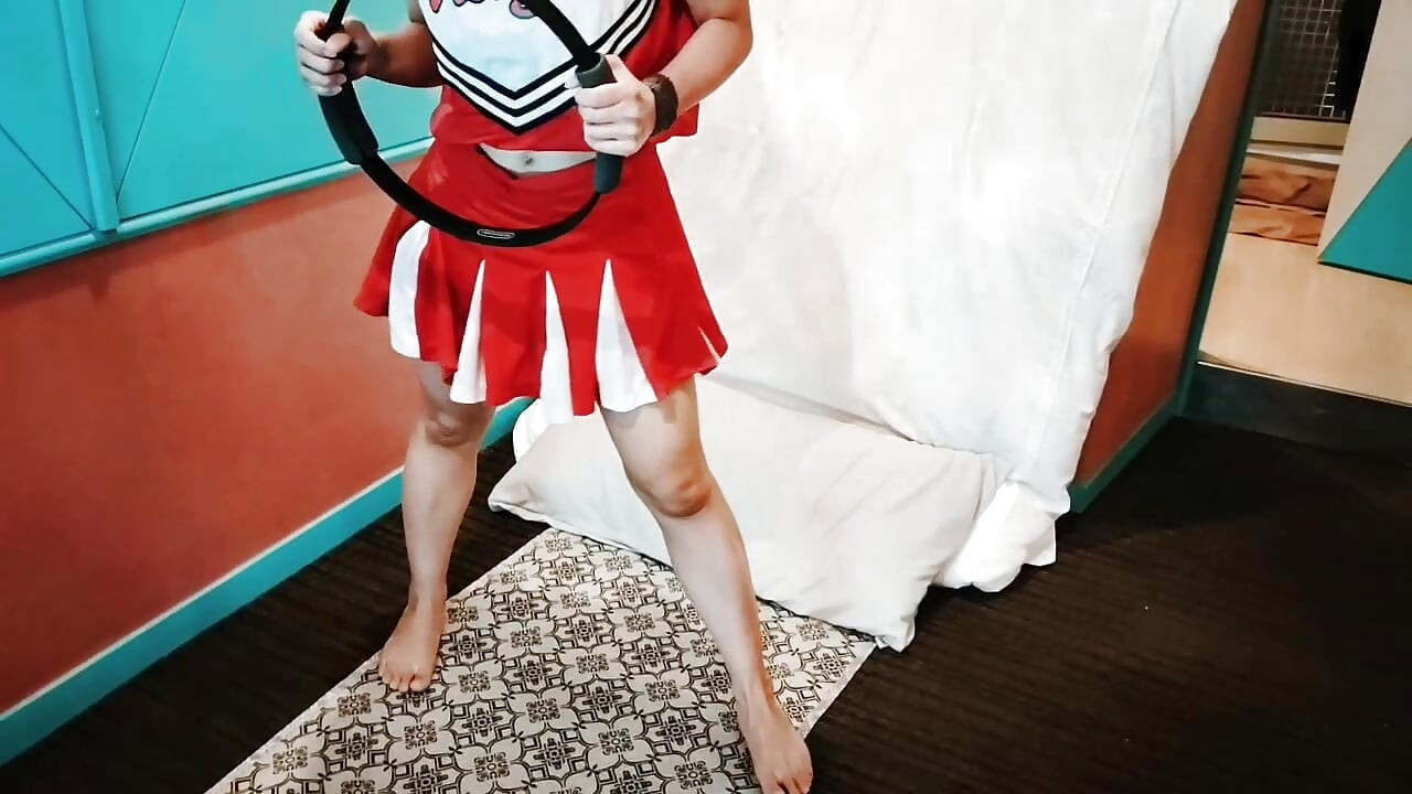 A cute, busty married woman does exercise 1 in an erotic cheerleader costume. Home made amateur Private Shoot