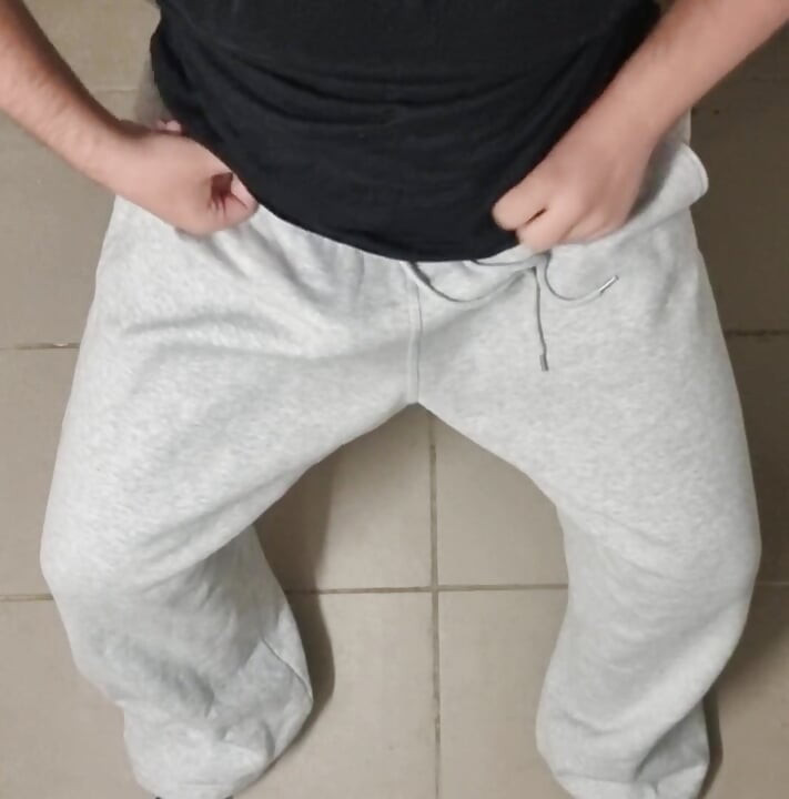 Big cock comes in gray sweatpants