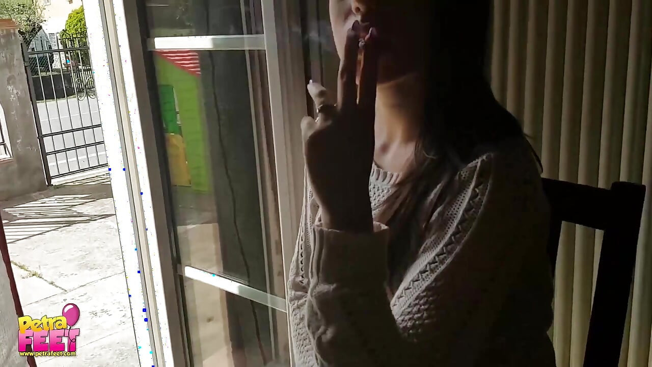 Gorgeous brunette teasing everyone with her smoking
