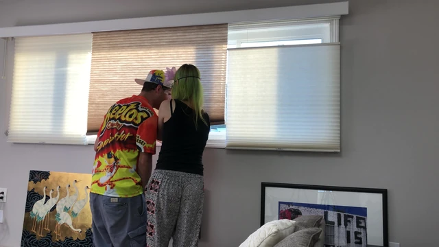 Couple Peeping Outside Apartment Window