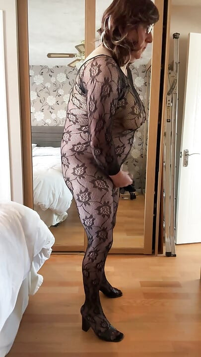 Sexy crossdresser wearing and wanking in lace sheer bodystocking.