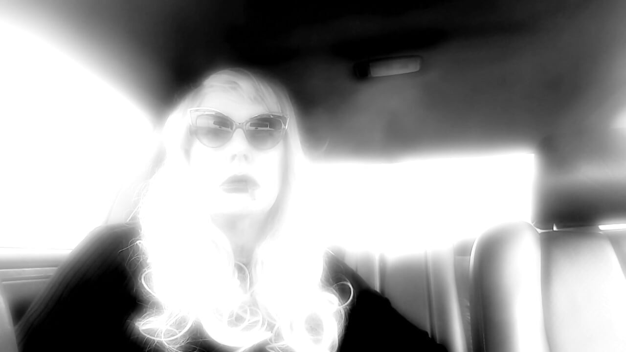MATURE TG CD SMOKING MORES IN MY RIDE - LOTS OF DANGLING LONG CIGARETTES