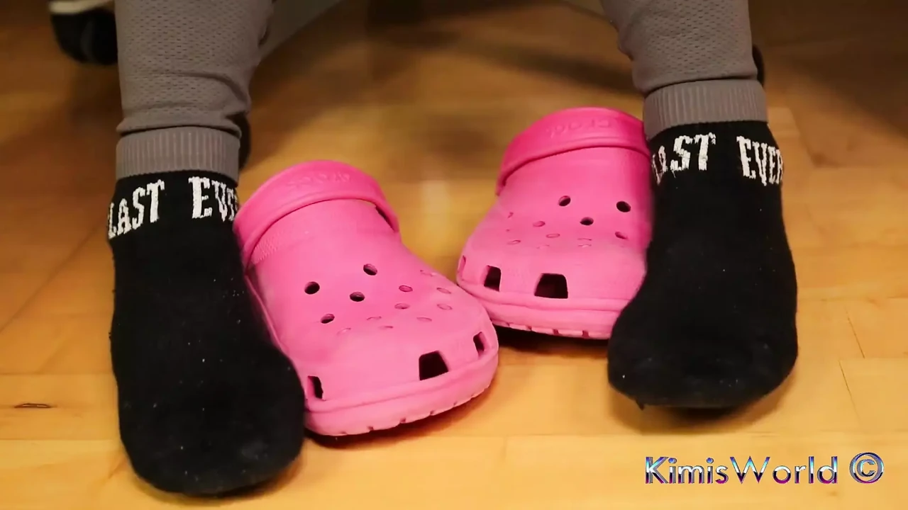 Under Desk Foot Play - Pink Clogs and Worn Socks