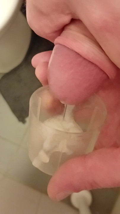 Cumshot in plastic cup