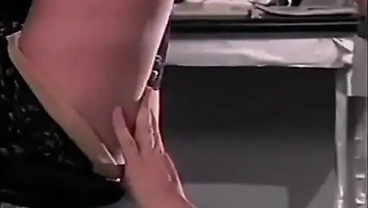 Sexy redhead in high heels gets feet licked in the office
