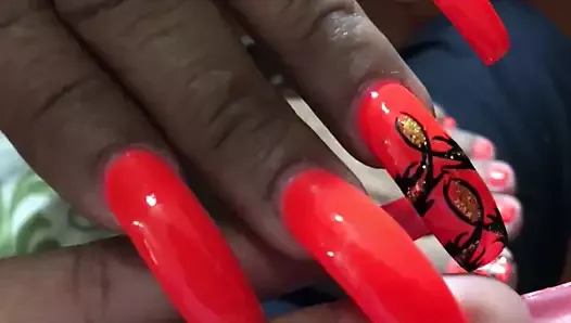 Latina with sexy long orange(different design) nails