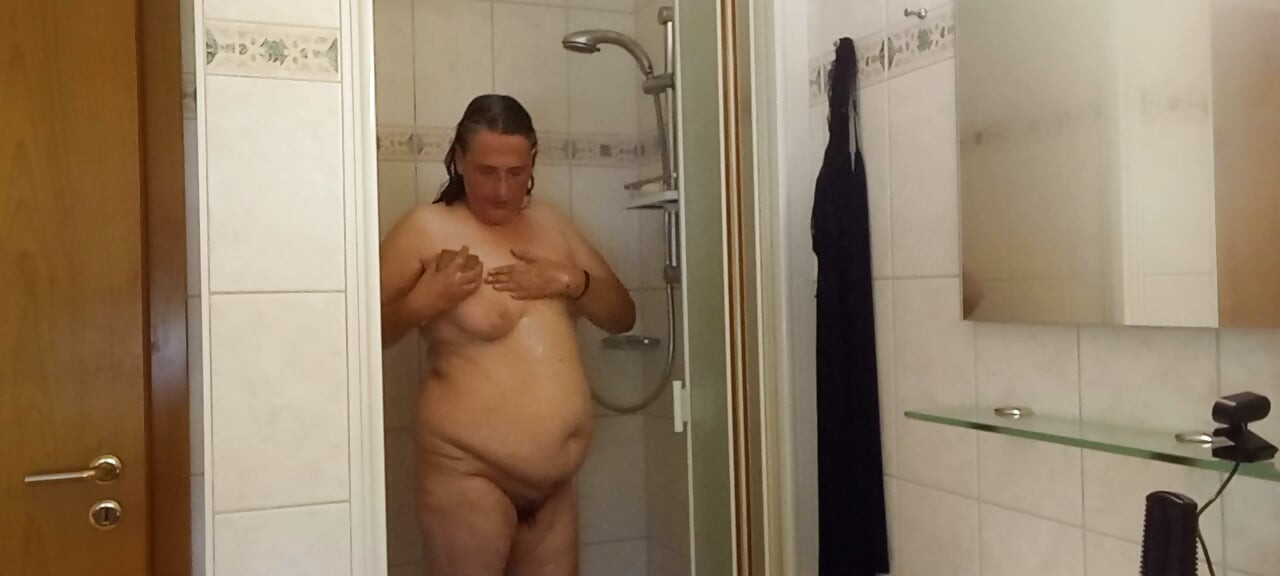 Chubby mature woman in the shower - soft belly - part 2
