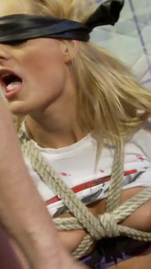 Bounded with ropes and blndfolded blonde in threesome bag | Clip 1