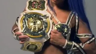 WWE - Sasha Banks with a title belt