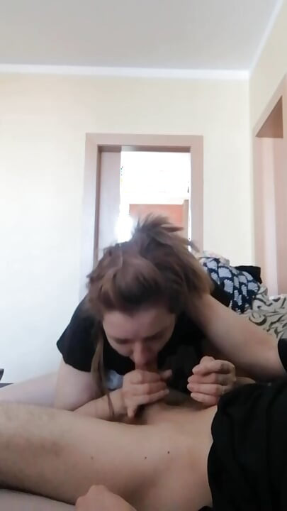 While he watches TV, I give him a blowjob
