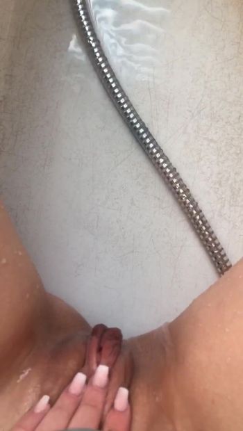Skinny teen fucks shower head!