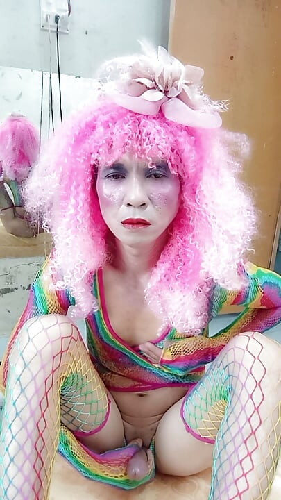 Transgender Le wears sexy clothes and plays cups of sex. Artificial cans
