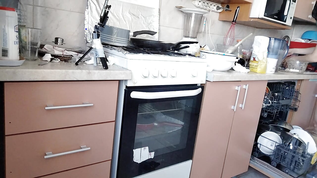 Sexy wife prepares lunch naked in the kitchen.