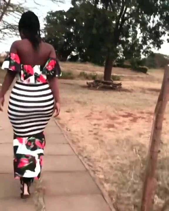 Big ass in tight long dress