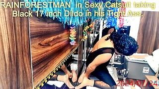 RAINFORESTMAN in Catsuit taking Black 17 inch Dildo in his Tight Ass.