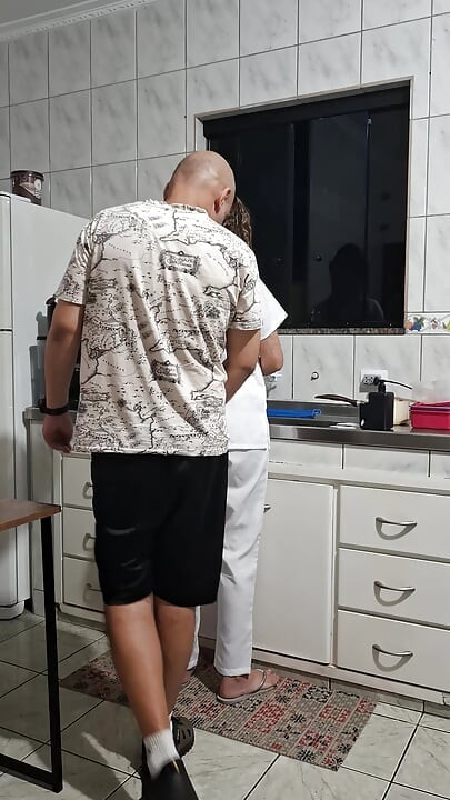 The maid got fucked in the ass in the kitchen while washing the dishes.