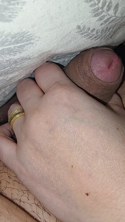 Hot step mom giving on her step son a handjob in bed