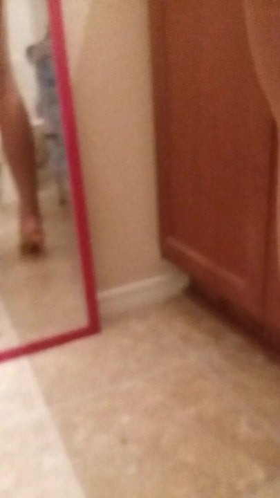 Tye dye mini skirt pantyhose and high heels