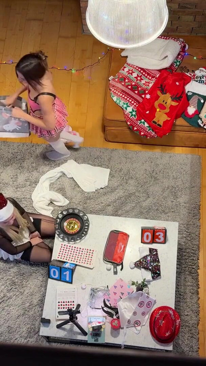 Two girls one guy handjob challenge party for Christmas with presents and roulette spinning | Clip 1