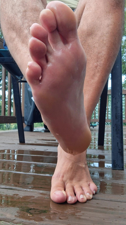 Showing off my bare wet male feet