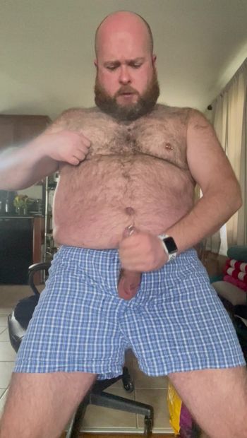 Hairy bear in boxers jerks his cock and shoots his load