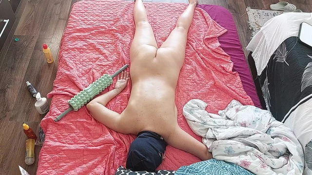 Sensual massage of a hot couple with oil on the body. Foreplay in the bedroom with an amateur couple.