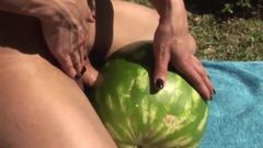 Shemale fucks a watermelon
