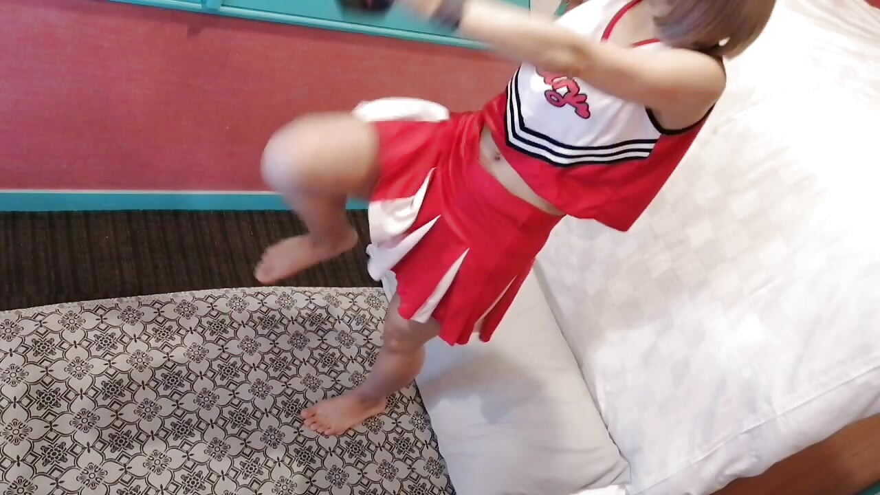 A cute, busty married woman performs exercise 4 in an erotic cheerleader costume. Peeking down from above. Home made amateur Private Shoot