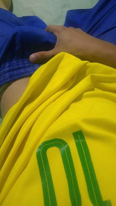 Pov young Brazilian guy masturbating big thick dick wearing the Brazilian national team uniform